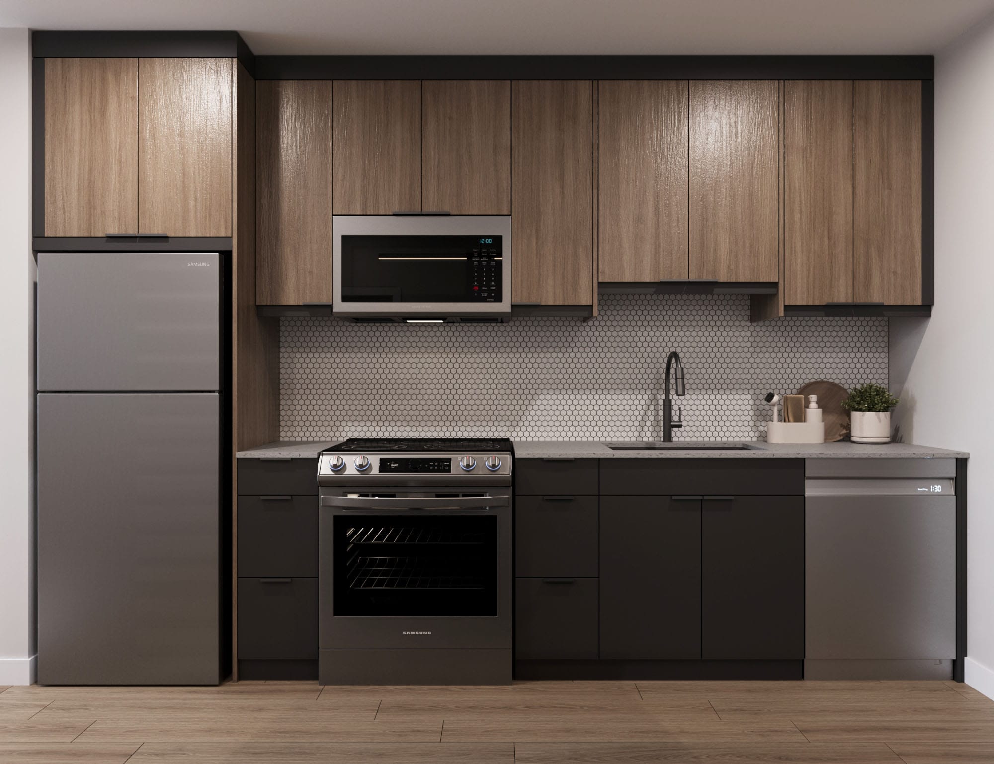 Modern, dark kitchen with kitchen island with bar stools and stainless steel appliances. Located at The Cornerstone.